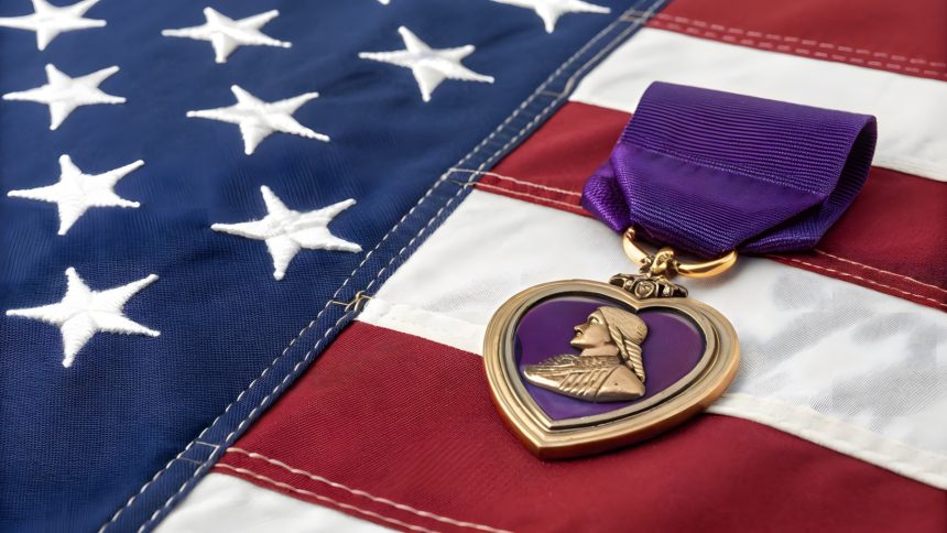 A Purple Heart medal rests on an American flag, a poignant symbol of sacrifice and bravery, honoring those wounded in combat, a testament to their service. Day 248: William Kyle Carpenter