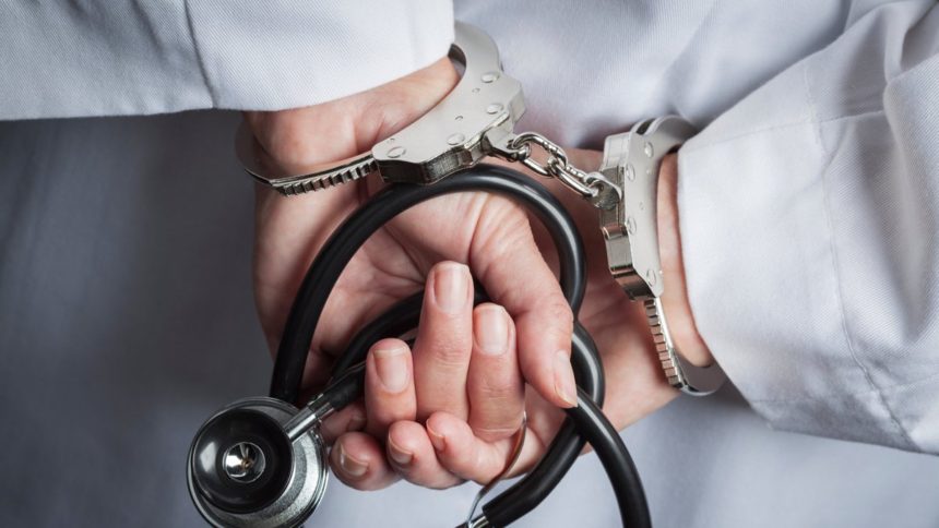 Paying the Public to Find Fraud: Inside the WHIP Program Handcuffed hands behind a white lab coat holding a stethoscope, illustrating health care fraud enforcement